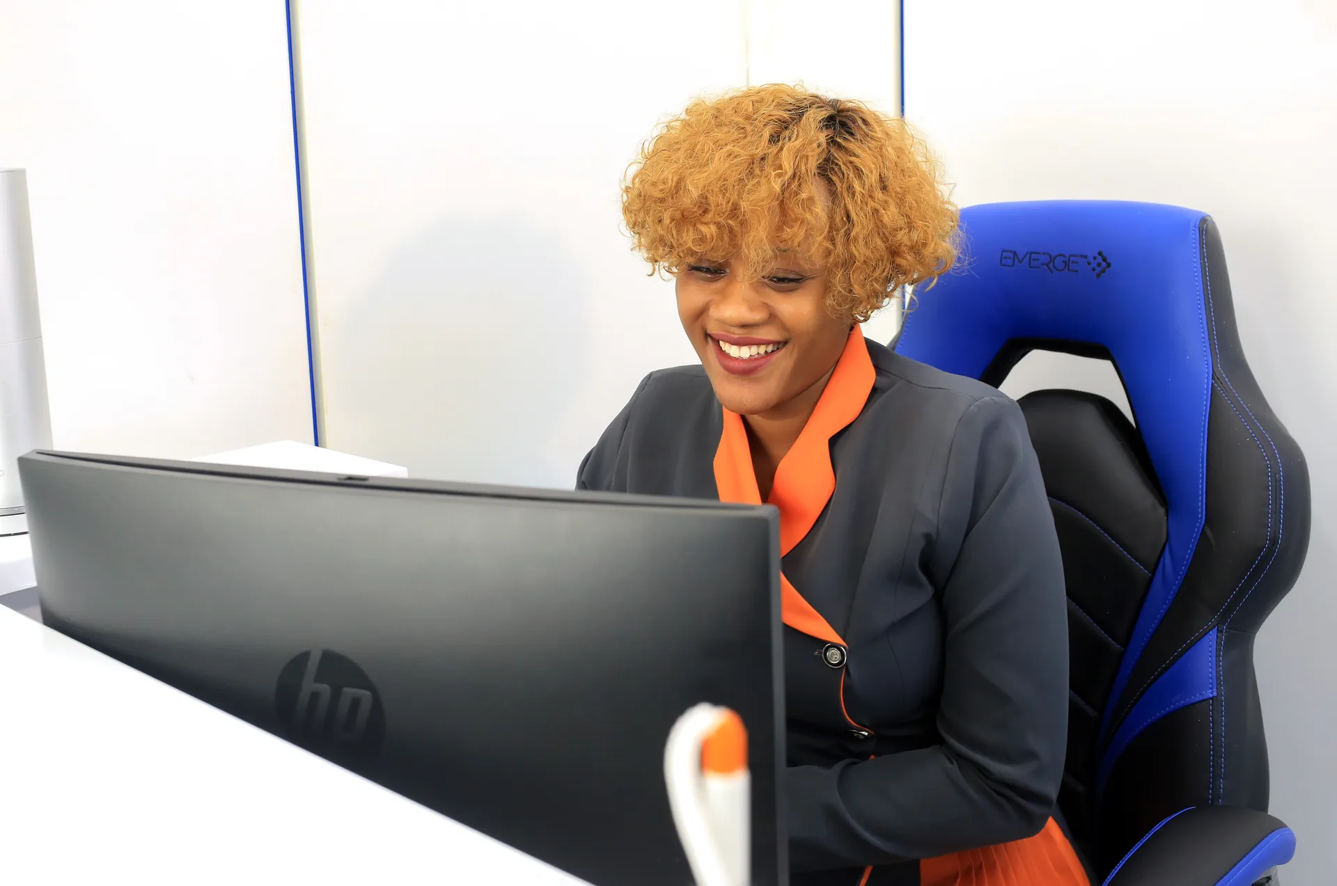 An Everight client services officer assisting a patient at the front desk